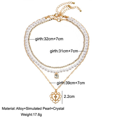 Collar de tres capas Vittoria | Perlas, diamantes de imitación y colgante de corazón – Serenyah