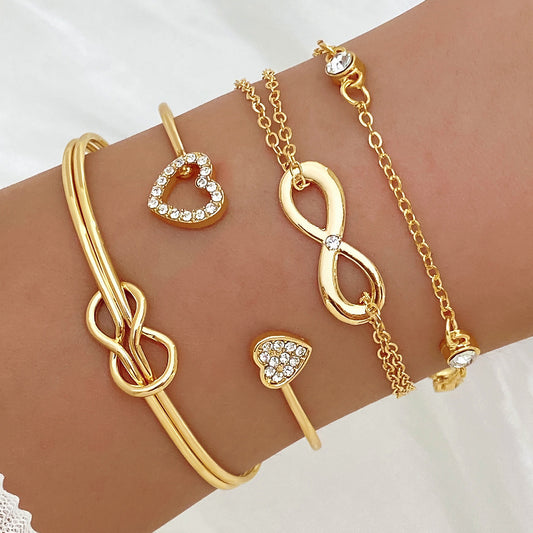 Conjunto Amoré Infinito – Stack de Pulseiras Coração Dourado e Infinito para Mulher | Serenyah