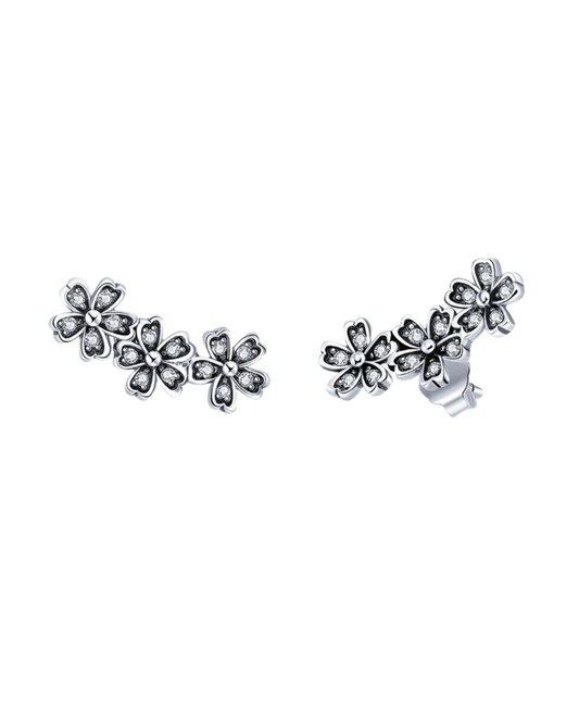 Pendientes Daiséa en plata 925 con flores de margaritas tachonadas y aro continuo detallado