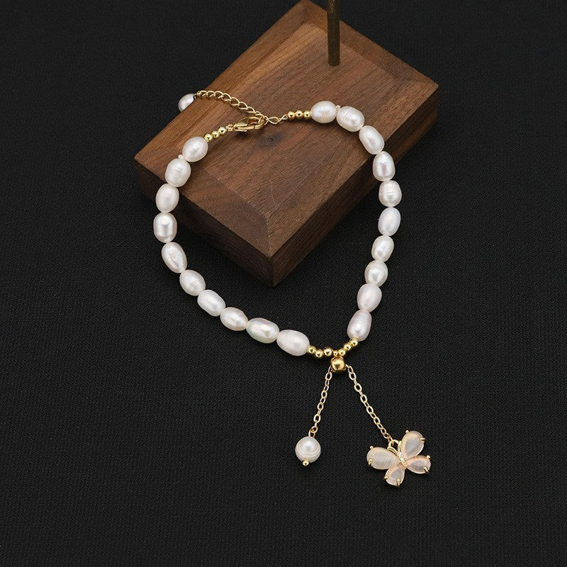 Liria Pearl – Pulsera de perlas naturales con mariposa y colgante | Tono dorado | Serenyah