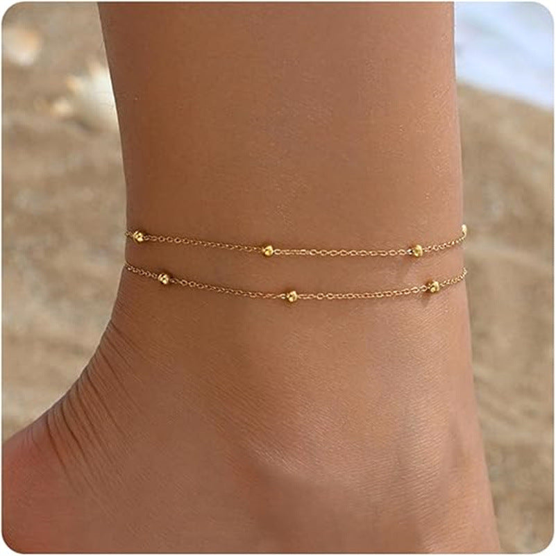Tobillera Mykonos – Pulsera de tobillo bohemia con cuentas y cadena dorada de Serenyah